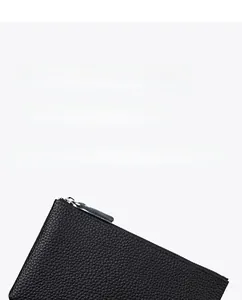 Close-up of black lychee grain leather clutch featuring a premium silver metal zipper