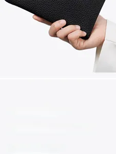 Detail of black pebbled genuine leather wallet showing large capacity storage
