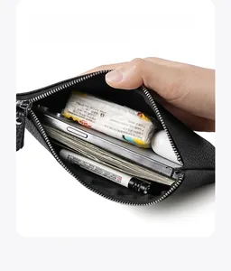 Internal view of large capacity black leather wallet showing smartphone and cash storage