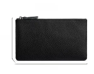 Front view of black pebble textured leather clutch bag with silver metal zipper detail