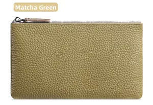 Macro detail of matcha green lychee grain leather wallet with high-quality metal zipper