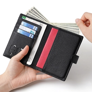 Black litchi leather RFID passport wallet with red interior and multi-card slots