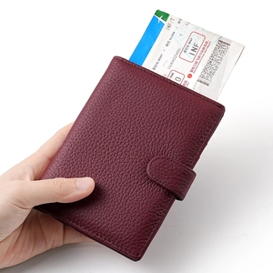 Burgundy RFID leather passport holder with lychee pattern and boarding pass pocket
