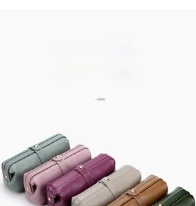 Macro view of leather cosmetic bags in six colors with litchi grain and metal snaps