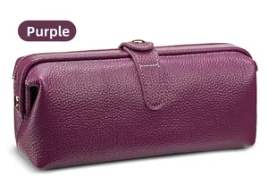 Detail of purple litchi grain leather texture with white stitching on makeup bag