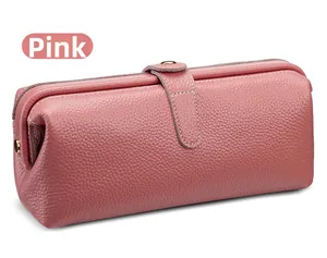 Close-up of pink lychee grain leather cosmetic bag with premium metal clasp detail