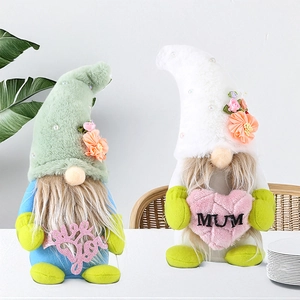 Close-up of handmade Mother's Day gnomes with flowers and Love You heart sign decoration