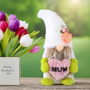 Detail of Mother's Day gnome holding a pink plush heart with MUM embroidery and flowers