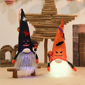 LED light-up Halloween gnomes set with pumpkin and bat hats on wooden bench