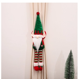 Detail of plush Christmas gnome curtain tieback with green hat and striped legs