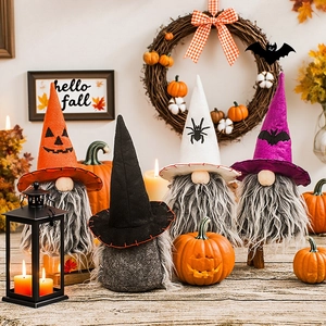 Halloween gnomes set with pumpkin and bat motifs on a cozy autumn home display