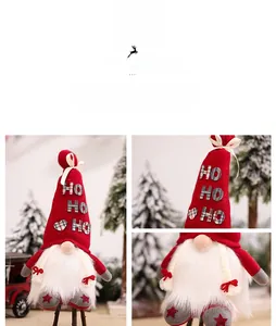 Detail of a Christmas gnome doll featuring a long red HO HO HO hat and white beard