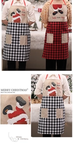 Detail of Christmas apron with red buffalo plaid pattern and Santa chimney print