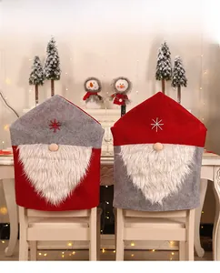 Detail of Christmas chair covers with gnome design, white faux fur and snowflake embroidery