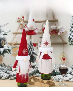 Close-up of festive Christmas gnome wine bottle covers with snowflake embroidery details
