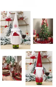 Detail of Christmas gnome wine bottle covers with snowflake embroidery and long faux fur