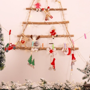 Hanging wooden Christmas photo wall ladder with colorful clips and festive decorations