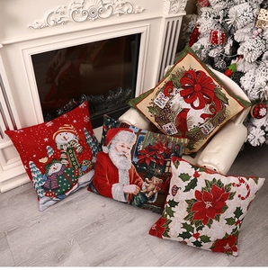 Set of four rustic Christmas throw pillow covers with Santa and snowman on white sofa