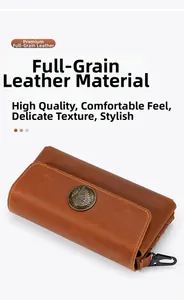 Detail of crazy horse leather phone pouch with vintage bronze chief badge and metal clip