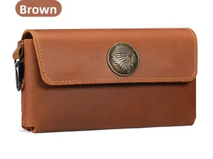 Detailed view of crazy horse leather phone holster with native emblem and metal hook