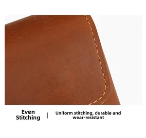 Macro shot of durable brown crazy horse leather belt pouch with precise yellow stitching
