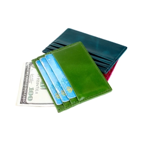 Three slim oil wax leather card holders in green, blue, and pink with multiple slots