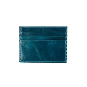 Close-up of teal oil wax leather card holder showing fine stitching and card slots