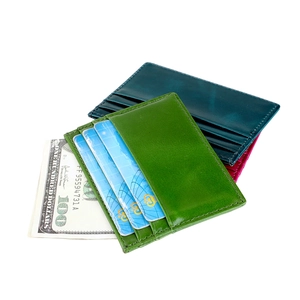 Slim oil wax leather card holder with multiple slots shown in green blue and rose pink