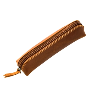 Handcrafted brown crazy horse leather pencil case with brass zipper on white background