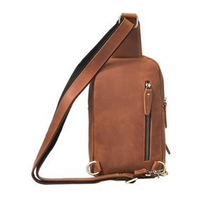 Macro detail of brown crazy horse leather texture with metal zipper and stitching on chest bag