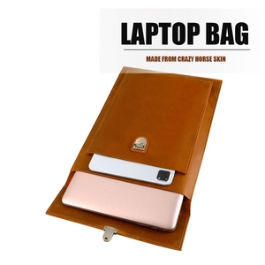 Detail of crazy horse skin laptop sleeve showing dual storage for laptop and tablet