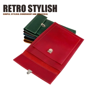 Stack of vintage leather laptop cases with retro metal locks and decorative stitching