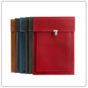 Vertical stack of leather laptop cases in six colors with vintage metal buckle detail