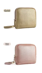 Litchi texture leather jewelry pouches in gold and rose gold with decorative tassels