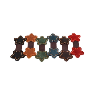 Detailed set of six star leather elastic hair bands with visible contrast stitching