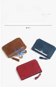 Detail of vintage crazy horse leather wallets showing internal card slots and coin pocket