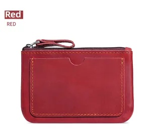 Macro view of vintage dark red leather coin purse with card slot and metal zipper