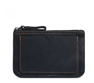 Detail of black crazy horse leather wallet with orange contrast stitching and U-shape card slot