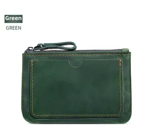 Detail view of green crazy horse leather coin purse with zipper and front card slot