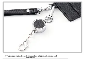 Detail of black lychee leather lanyard with retractable reel and silver metal hook