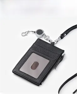 Detail of black leather ID card holder with retractable lanyard and zipper pocket