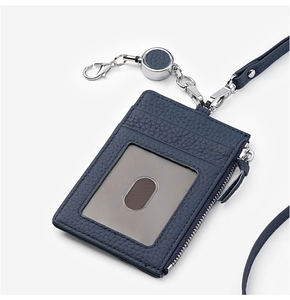 Detailed close-up of blue leather ID holder with zipper pocket and retractable metal buckle