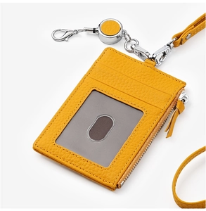 Yellow pebbled leather ID holder with side zipper pocket and retractable neck lanyard
