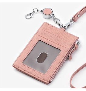 Pink litchi grain leather badge holder with card slots and a silver retractable buckle