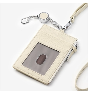 Detail of lychee pattern leather ID card holder with metal zipper and retractable lanyard