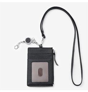 Detailed view of black litchi leather ID holder with lanyard and retractable reel