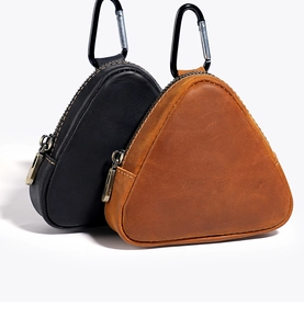 Close-up of vintage crazy horse leather coin pouch with sturdy metal carabiner and zipper