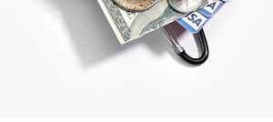 Close-up of black metal carabiner clip for wallets and keys with coins and cards