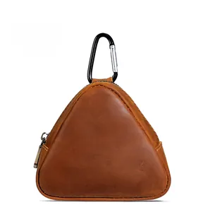 Detailed view of triangular brown crazy horse leather coin pouch with black carabiner
