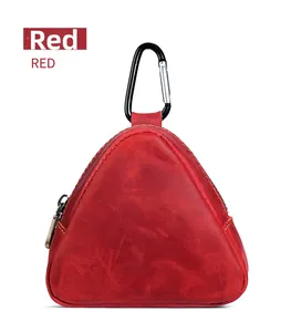 Detail of red crazy horse leather triangle coin pouch with vintage texture and D-ring